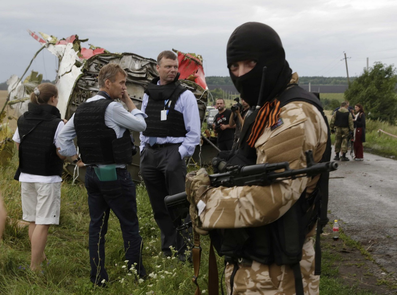Un 1er rapport sur les circonstances du crash du vol #MH17 en Ukraine à la mi-juillet sera publié mardi